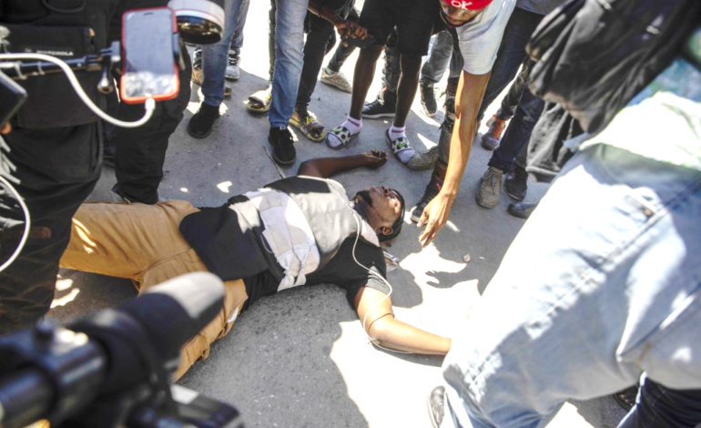  JOURNALIST KILLED, TWO WOUNDED AS POLICE CLASH WITH HAITIAN WORKERS