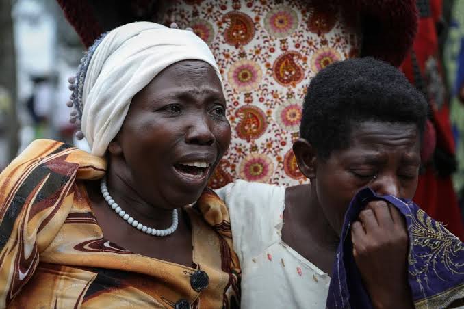 UGANDA FAMILIES BURY THEIR DEAD AFTER SCHOOL ATTACK